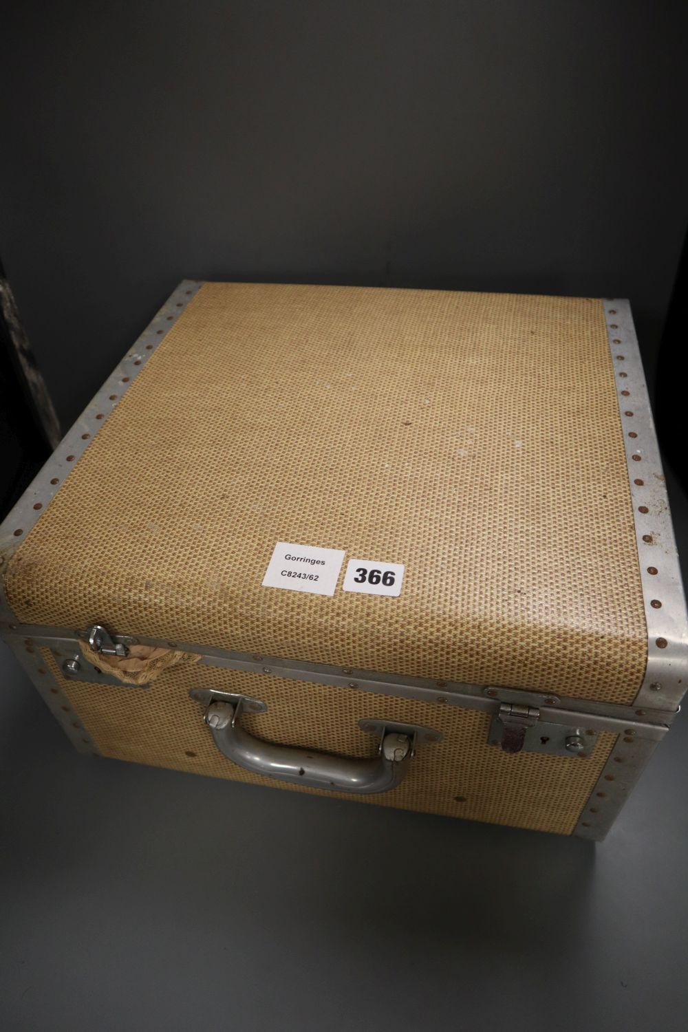 A Harrods suitcase containing 1900-40s cream chiffon and silk blouses, etc and a petit point bag